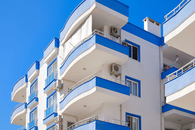 Blue and white multi storey residential building. modern apartment building.