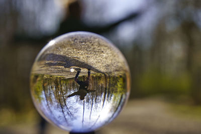 Close-up of crystal ball on metal