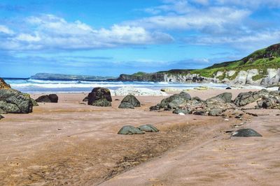 Scenic view of beach against sky