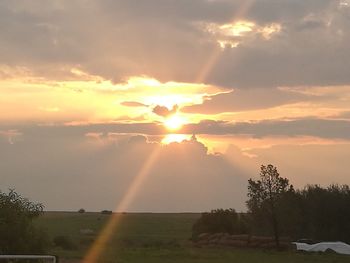 Scenic view of landscape against sky during sunset