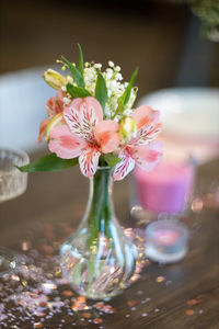 Close-up of pink flower vase on table