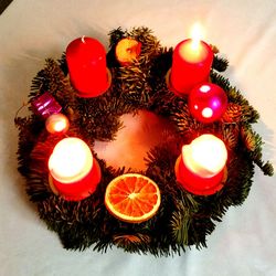 Close-up of lit candles in the dark