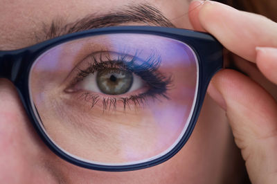 Close-up portrait of woman with reflection