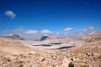 Scenic view of mountains against cloudy sky