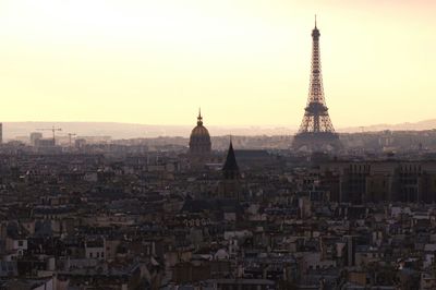 Cityscape against sky during sunset