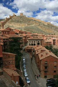 High angle view of buildings in city against sky