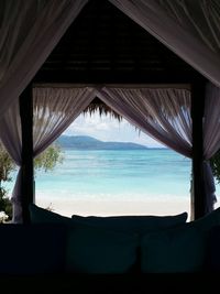 Scenic view of sea seen through window