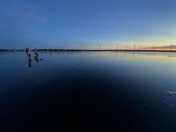 Scenic view of lake against blue sky