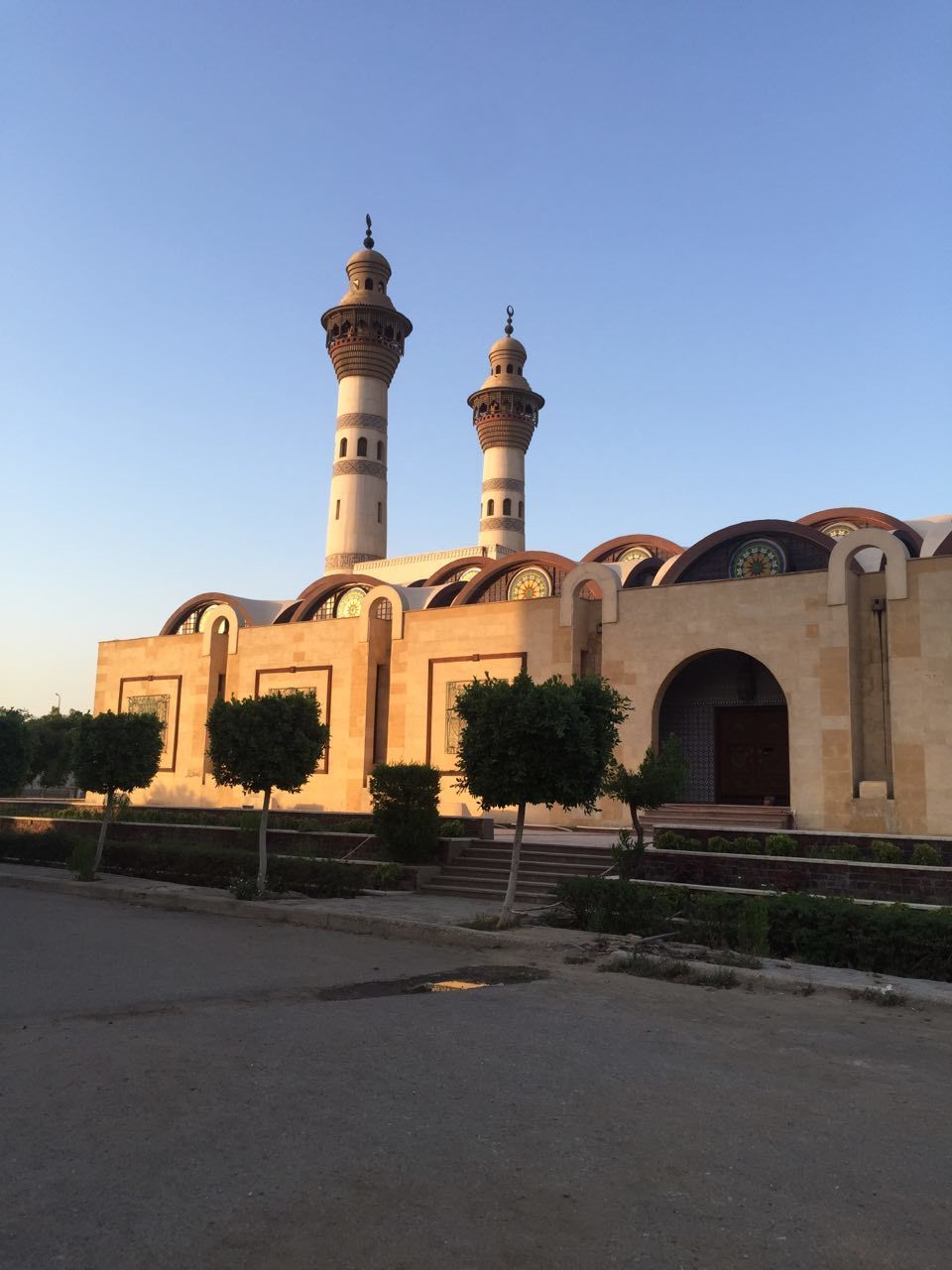 VIEW OF BUILDING AGAINST BLUE SKY