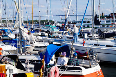 Boats moored at harbor