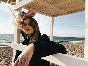 Portrait of beautiful young woman at beach