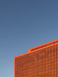 Low angle view of building against clear blue sky