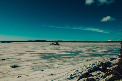 Scenic view of sea against blue sky