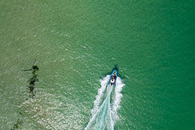 High angle view of people on boat in sea