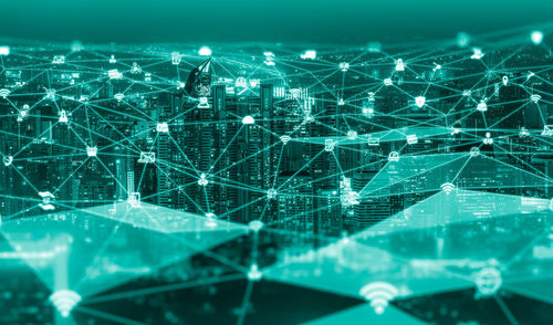 Aerial view of illuminated city at night