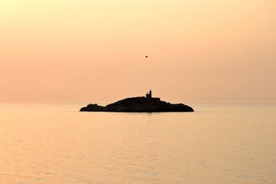 Scenic view of sea at sunset