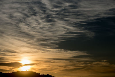 Sun shining through clouds