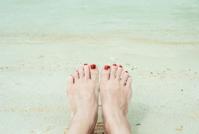 Low section of woman at beach