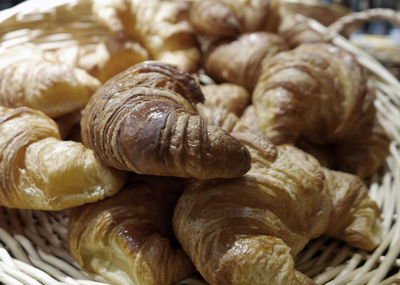 High angle view of croissants in basket for sale at bakery
