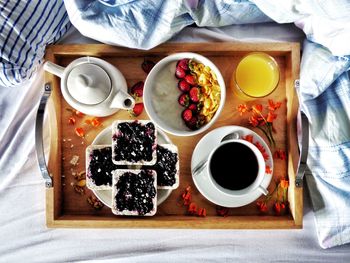 Directly above view of breakfast served on bed at home