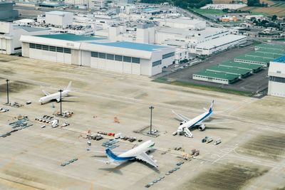 High angle view of airplane on airport runway