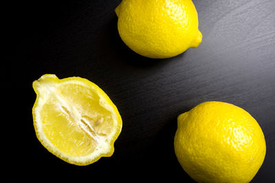 Close-up of lemon slice against black background