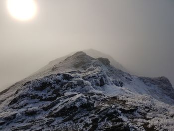 Scenic view of snowcapped mountain against sky