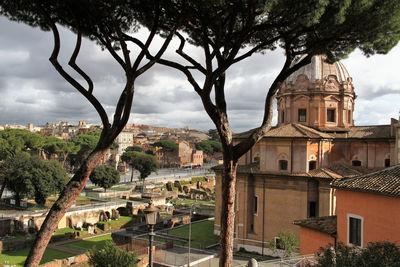 Panorama of rome on via dei fori imperiali, church of santi luca e martina on the right.