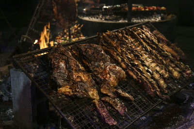 High angle view of meat on barbecue grill