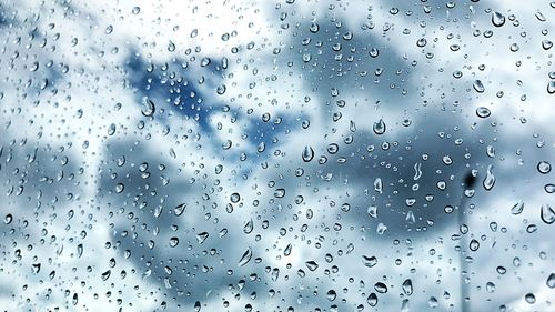 Full frame shot of raindrops on window