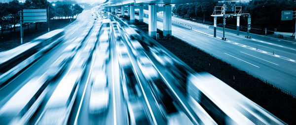 High angle view of light trails on road