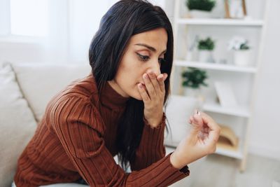 Young woman using phone