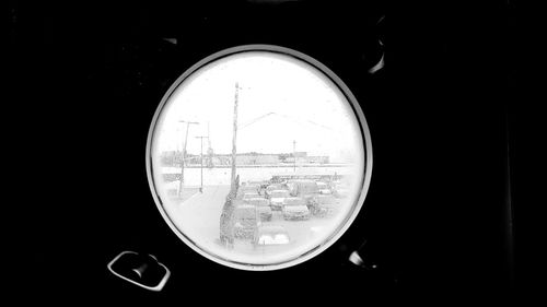 Close-up of car windshield against black background