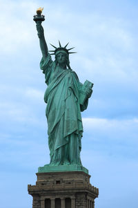 Low angle view of statue against cloudy sky