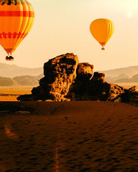 Hot air balloons flying against sky