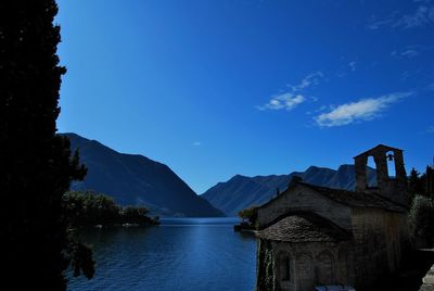 Scenic view of mountains against blue sky