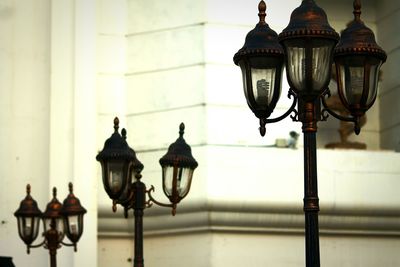 Close-up of street light against wall