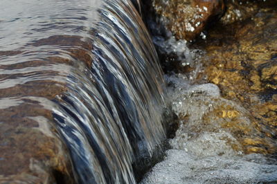 Close-up of stream flowing through rocks