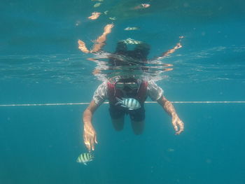 Man swimming in sea