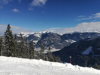 Scenic view of snowcapped mountains against sky