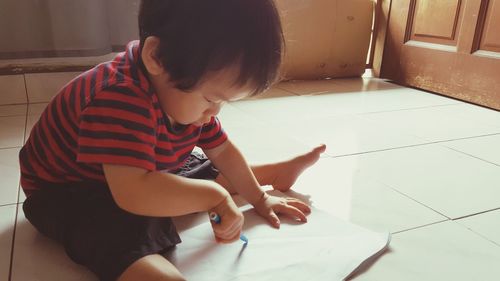 High angle view of boy playing at home