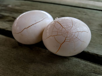 Close-up of broken egg on table