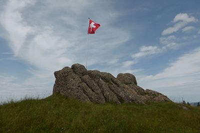 Low angle view of flag against sky