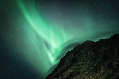 Scenic view of mountain against sky at night