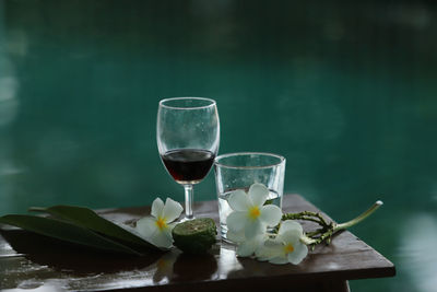 Glass of white and wine on table