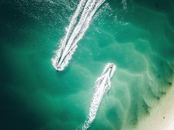 High angle view of boats moving in sea