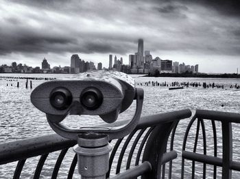 Cityscape against cloudy sky