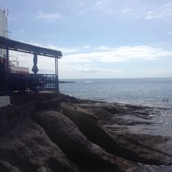 Scenic view of sea against cloudy sky