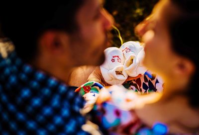 Defocused image of couple embracing outdoors