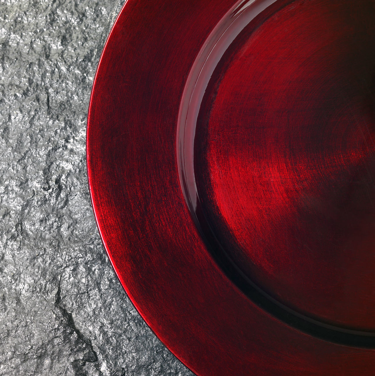 HIGH ANGLE VIEW OF RED CONTAINER ON TABLE